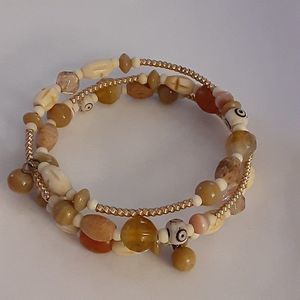 Copper natural tones twisted bracelet beaded